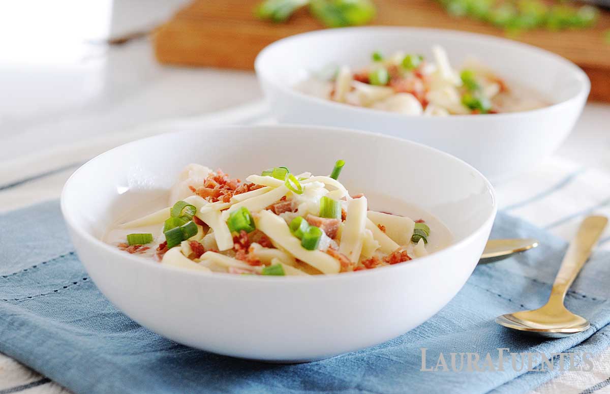 two bowls of crockpot loaded potato soup