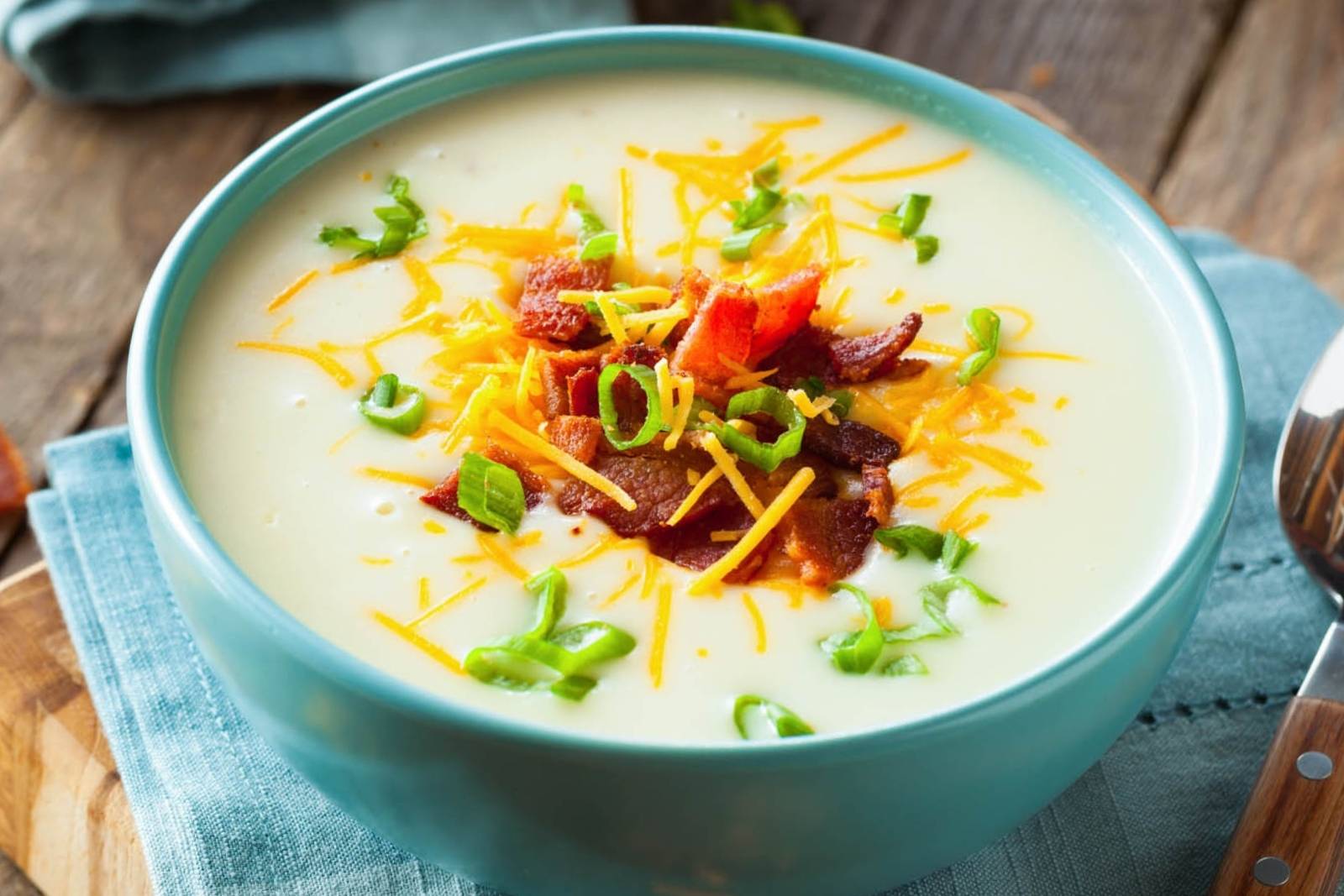 large blue bowl of potato soup