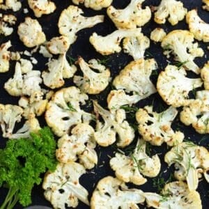 roasted cauliflower florets in a baking sheet