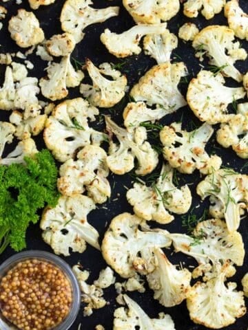 roasted cauliflower florets in a baking sheet