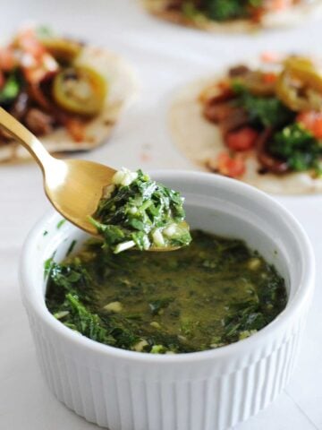 a spoon and a bowl with cilantro chimichurri