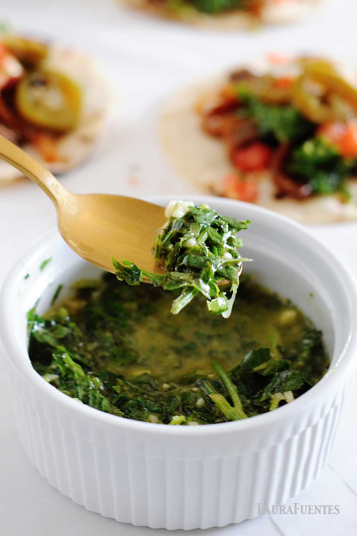 a spoon and a bowl with cilantro chimichurri
