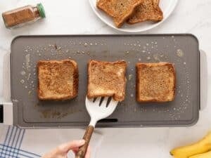 French toast being cooked in a griddle