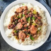 large plate of white rice topped with New Orleans red beans