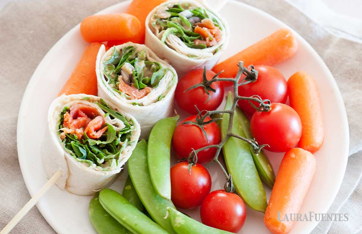 smoked salmon pinwheels with baby carrots, cherry tomatoes and snap peas