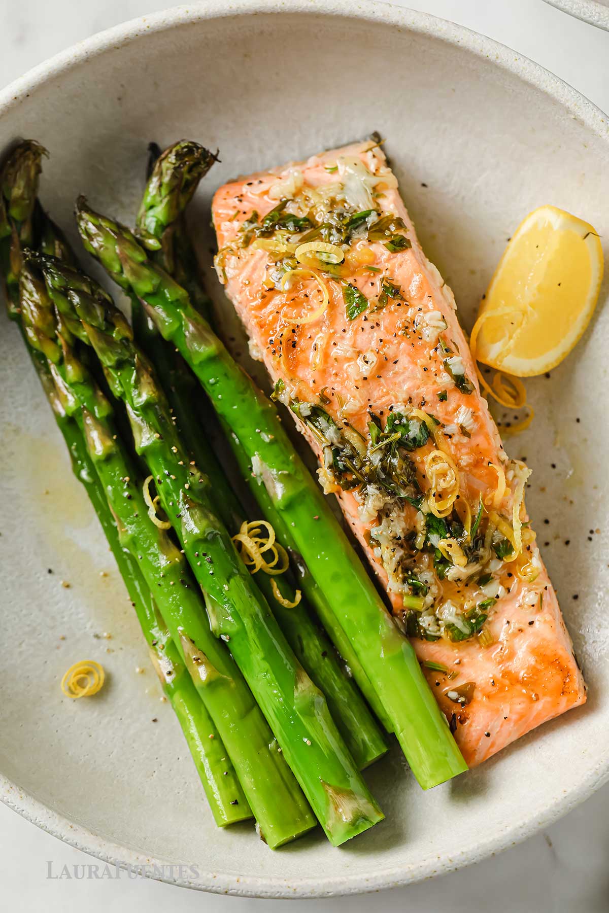 Garlic Butter Salmon with asparagus in a dish