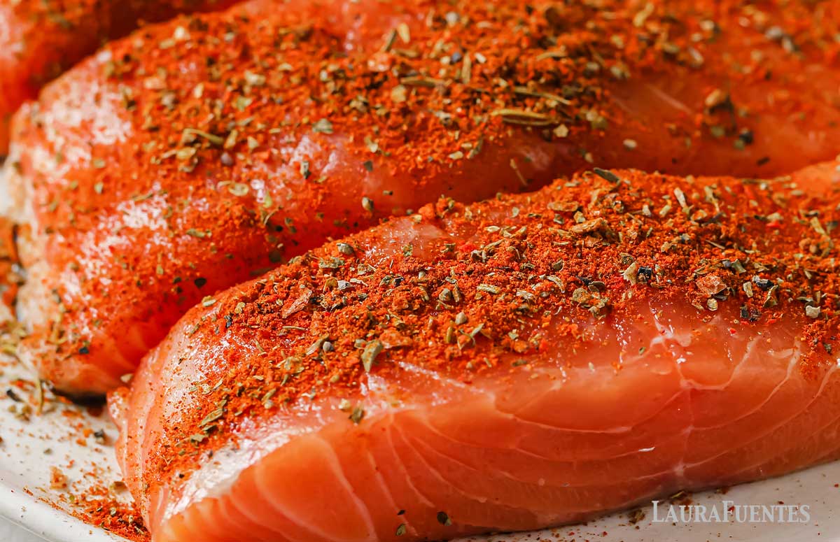 raw salmon fillets seasoned