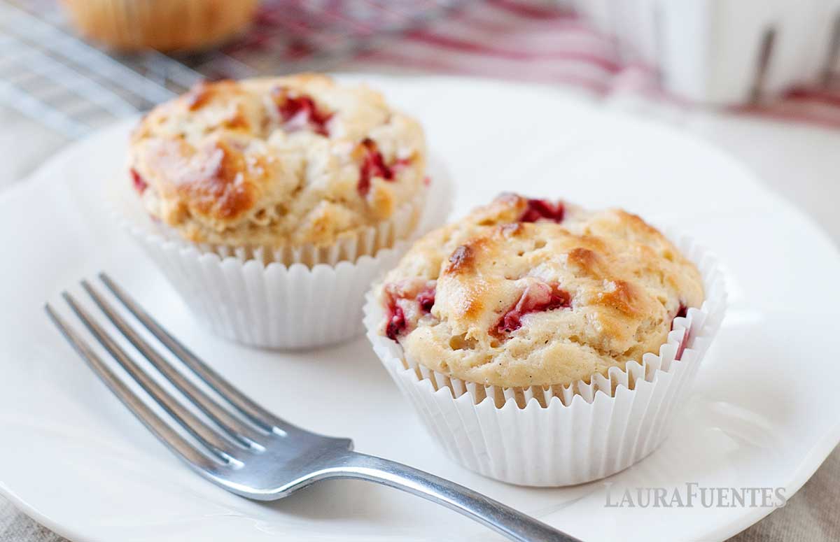 a plate with two strawberry muffins made with frozen strawberries