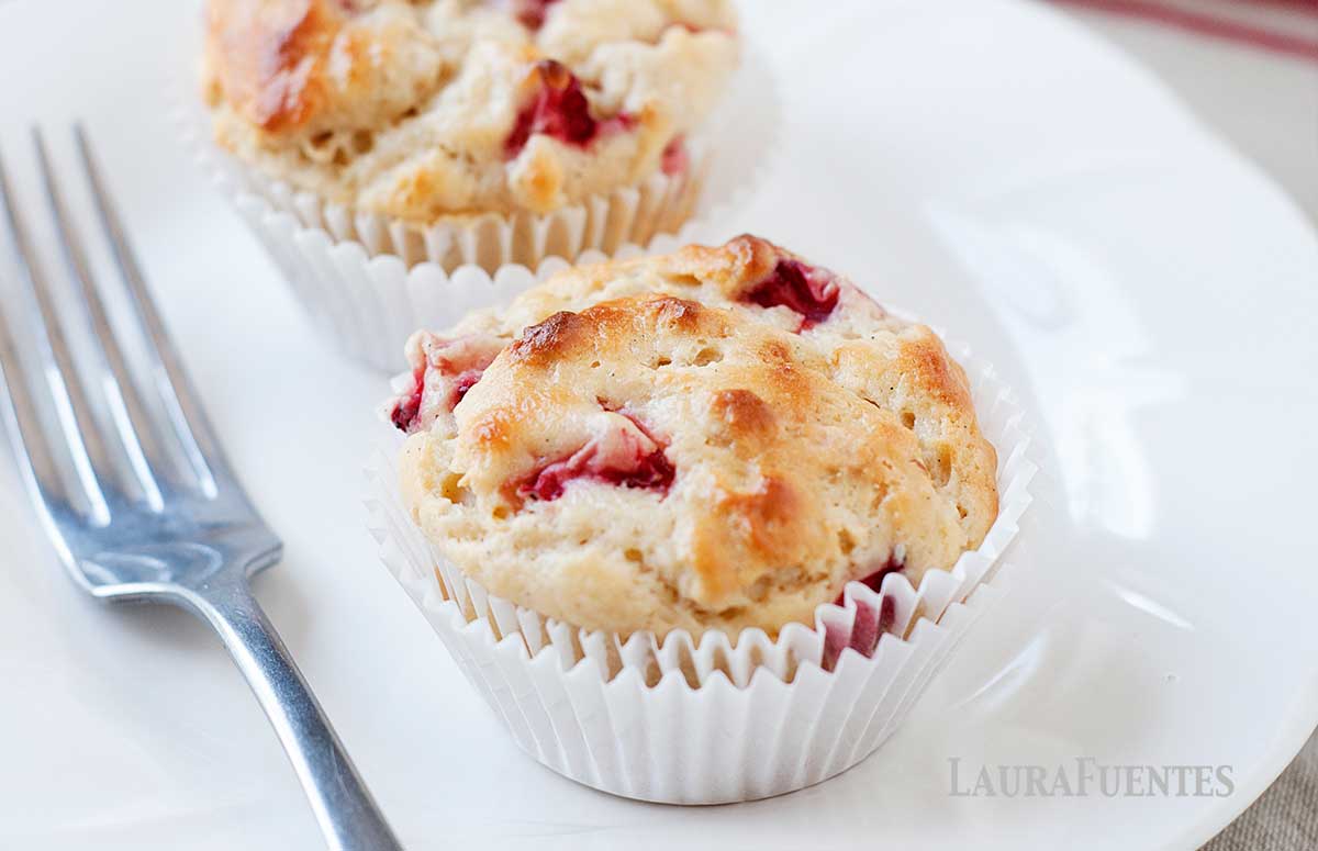 a plate with two strawberry muffins