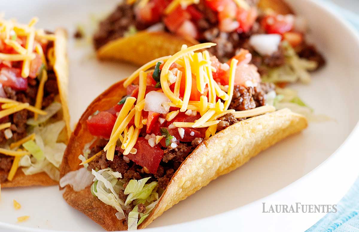 three hard shell tacos