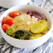 bowl of salmon in a bowl with rice and vegetables