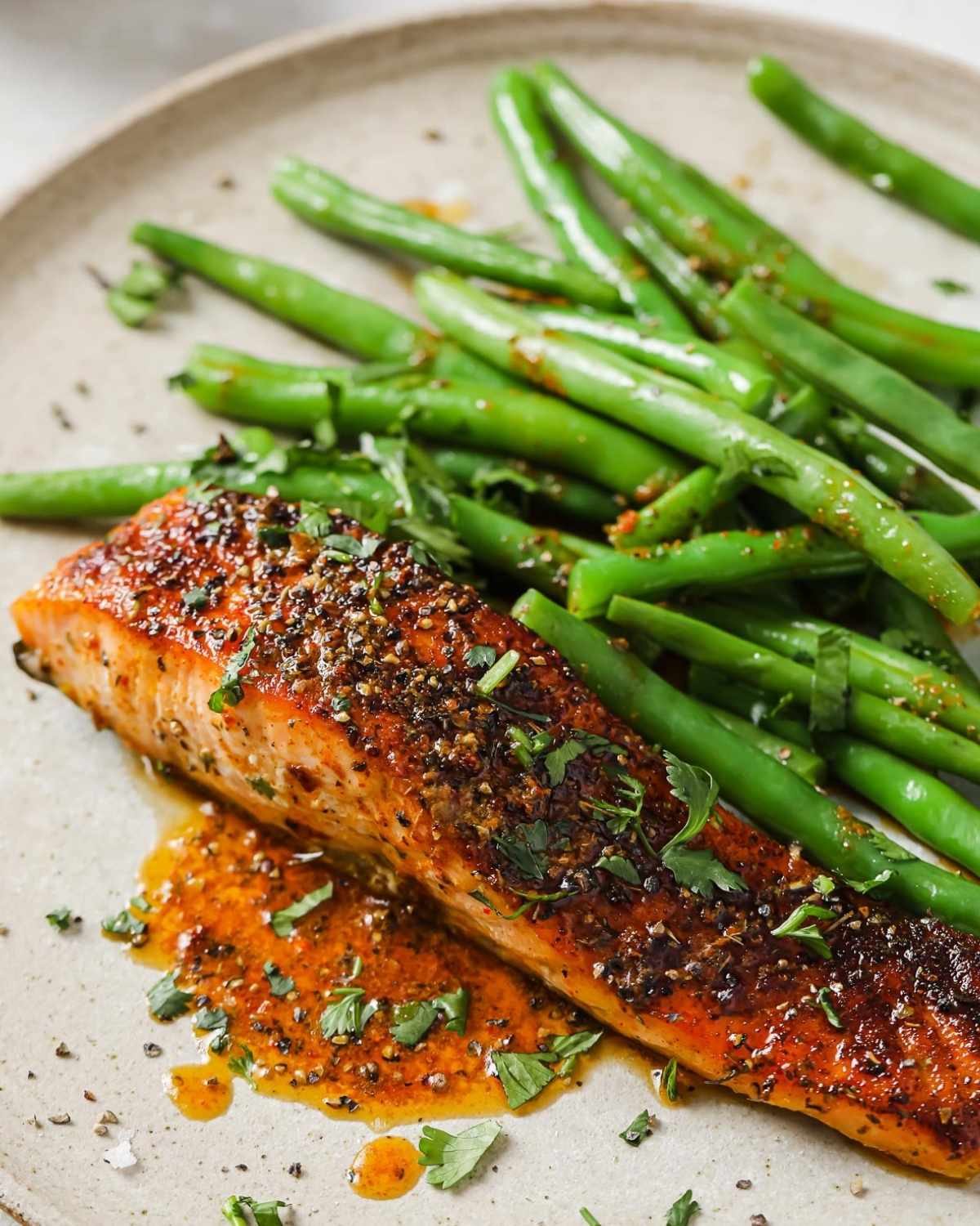 salmon fillet with green beans in a dish