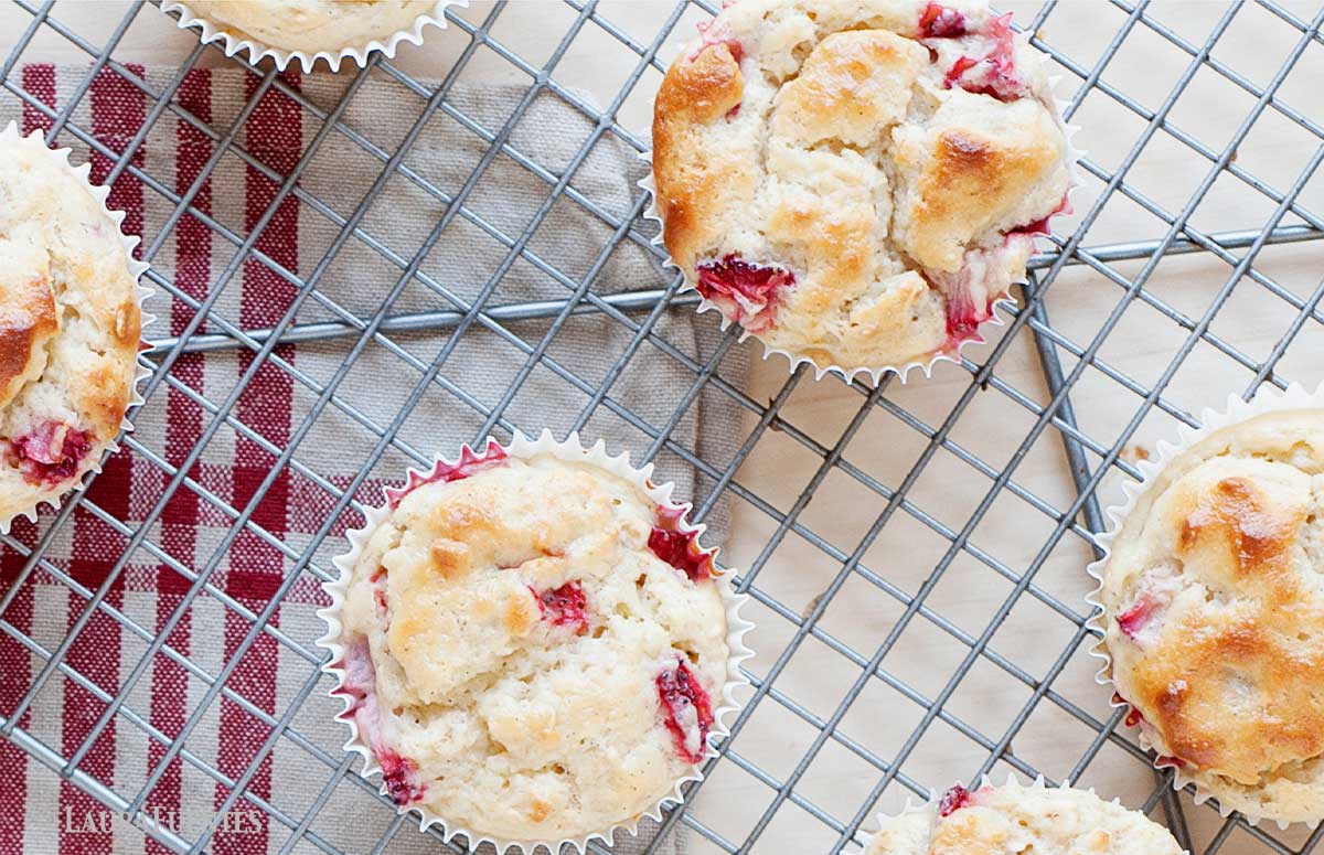 strawberry muffins made with frozen strawberries on a cooling rack