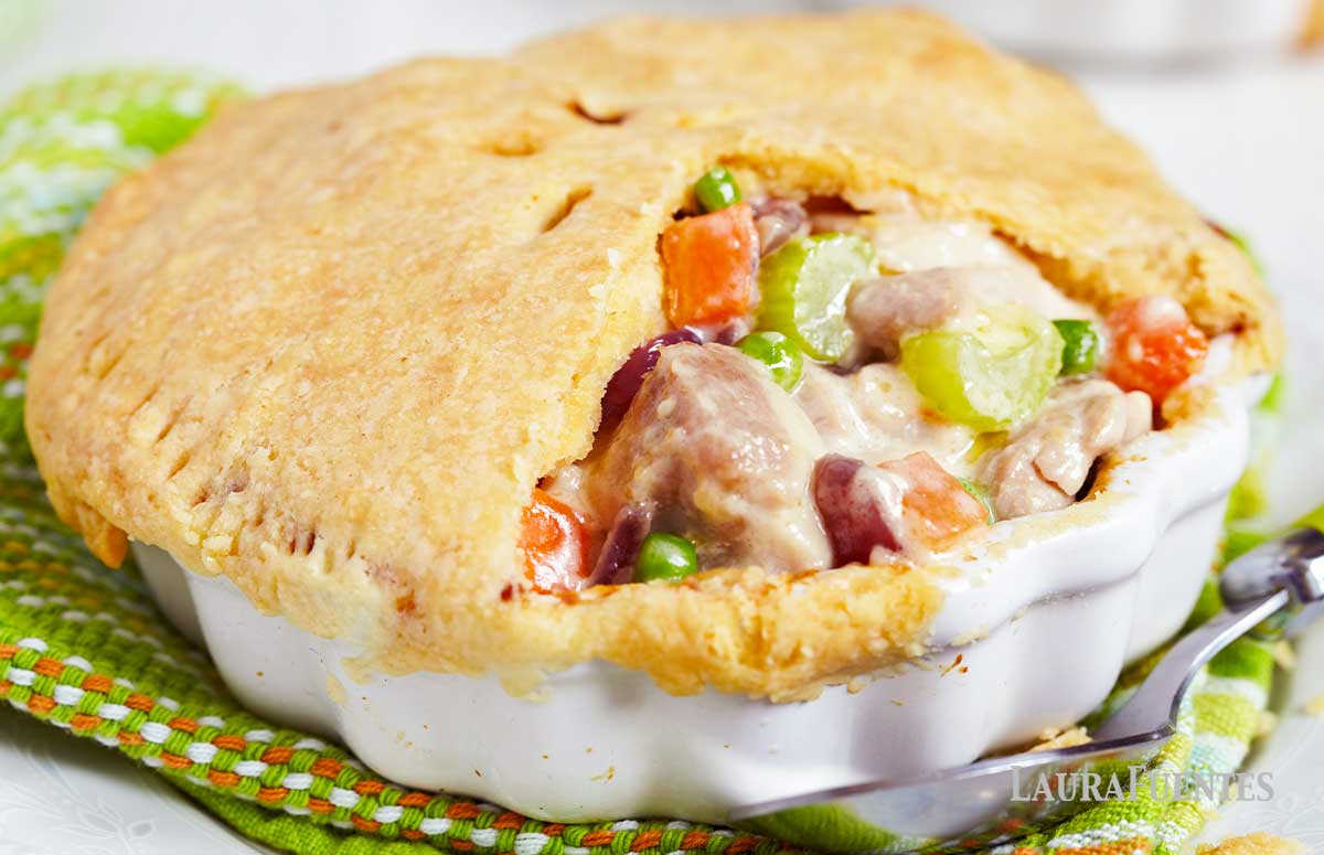 Gluten-Egg-Free Mini Chicken Pot Pies Recipe MOMables.com closeup of gluten-free chicken pot pie with part of the top crust removed so the filling is visible
