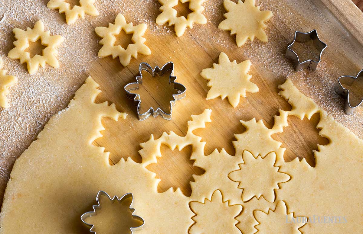 cut out snowflake sugar cookie dough