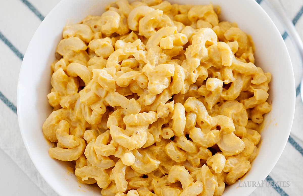 overhead view of cheddar mac and cheese in a white bowl