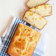 closeup of loaf of peach bread with three slices