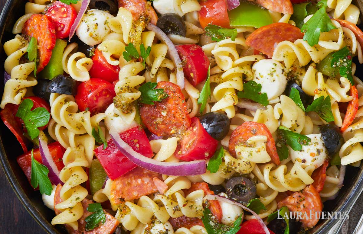 closeup of pizza pasta salad in a large serving dish