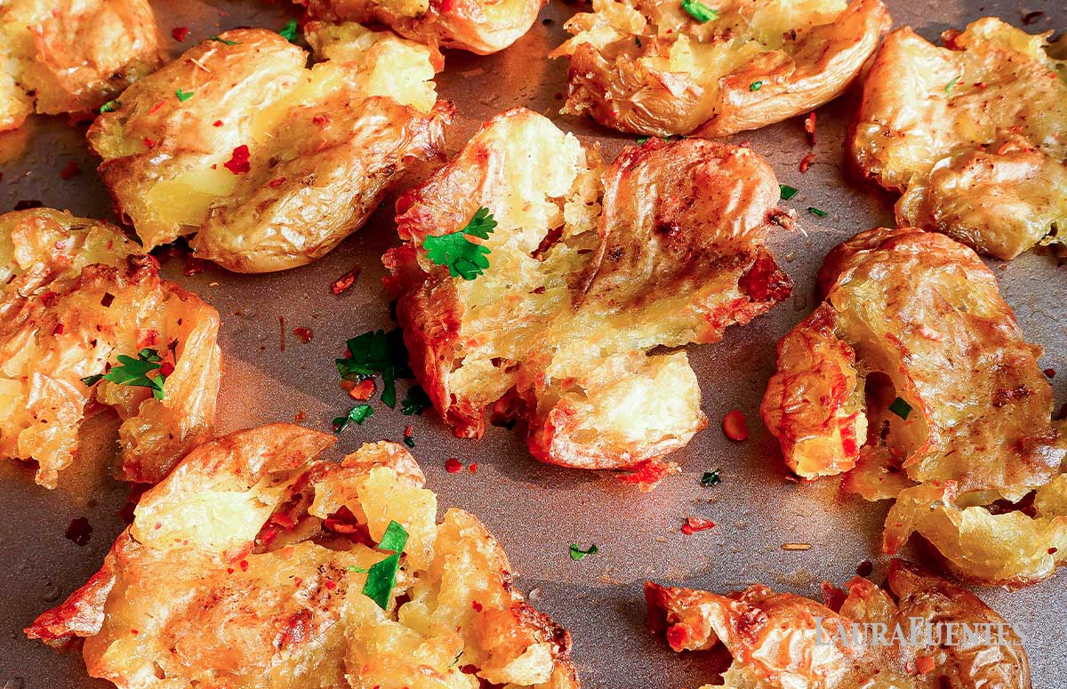 closeup of smashed potatoes on a baking sheet