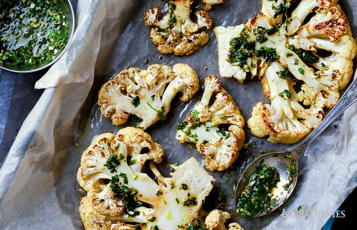 roasted cauliflower steaks in a baking dish