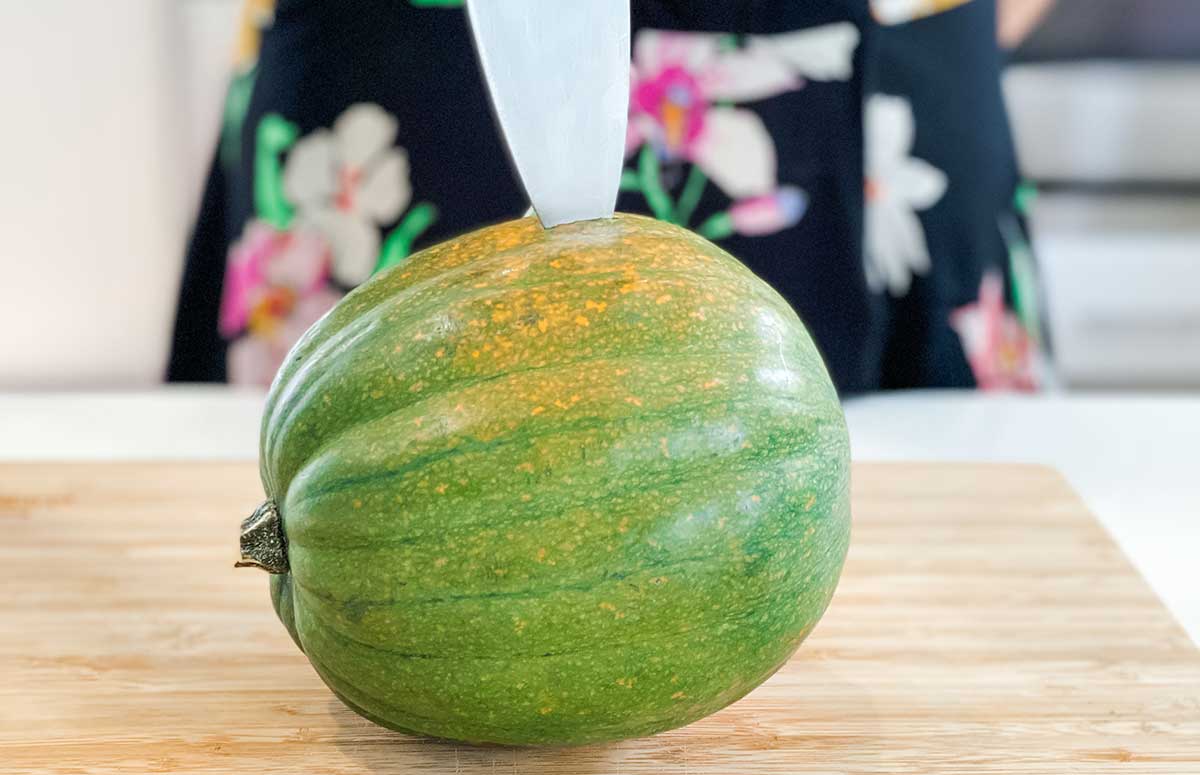 cutting an acorn squash 