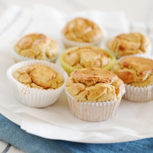 seven banana oat muffins on a white plate