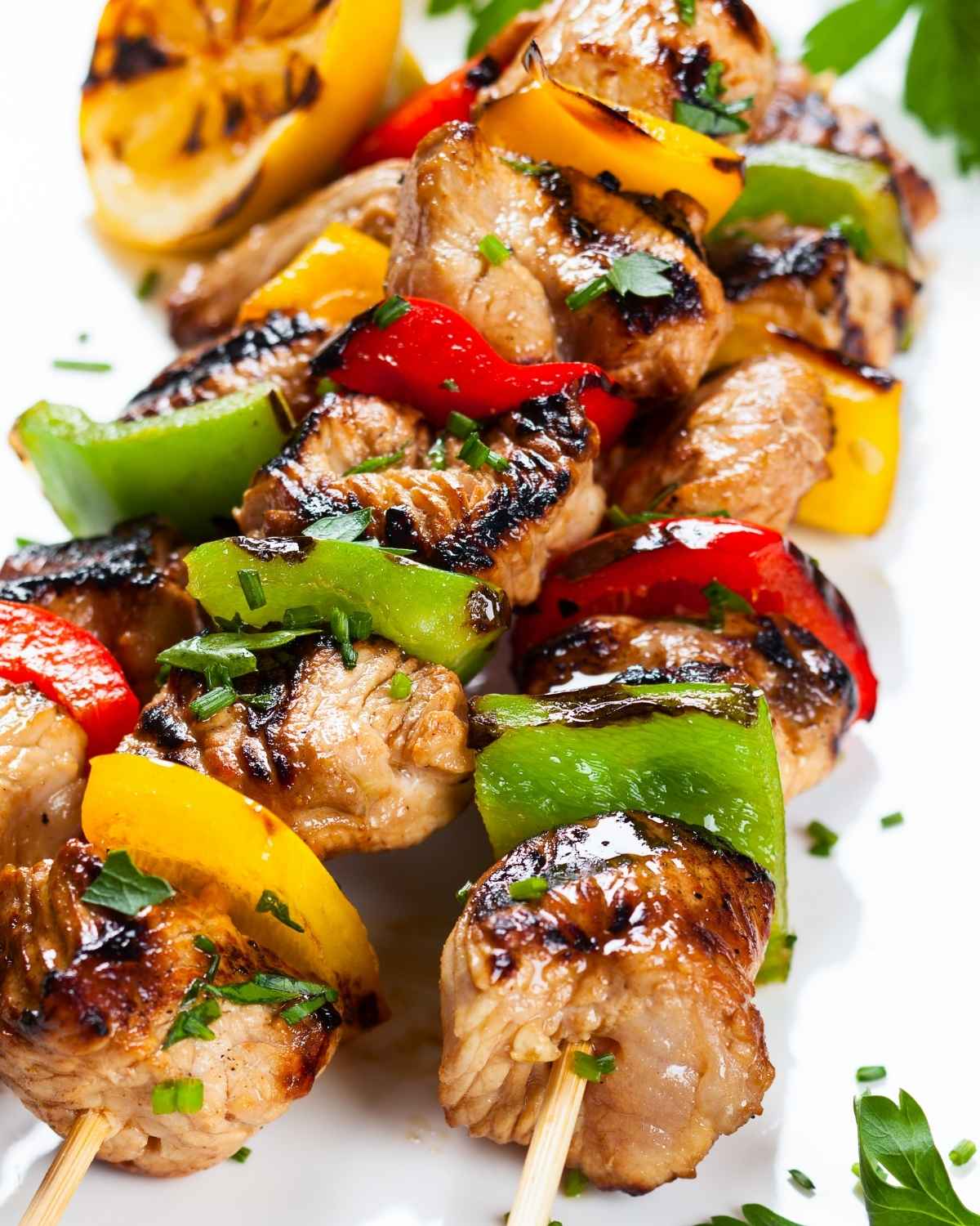grilled chicken and vegetable kabobs on a plate