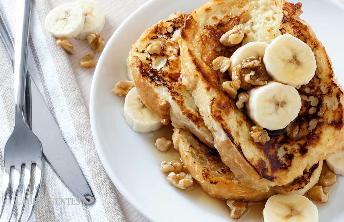 large slices of French toast topped with sliced bananas