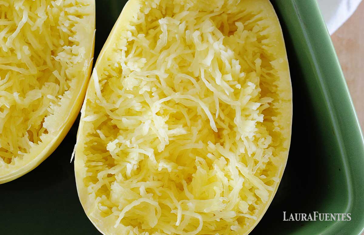 closeup of microwaved spaghetti squash in a green dish