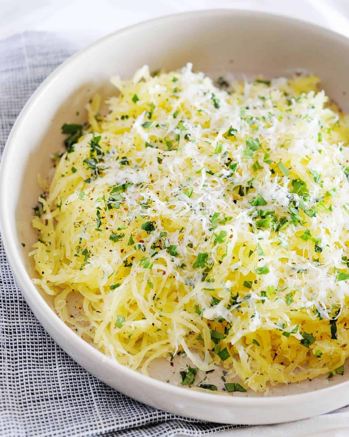 a bowl of parmesan garlic spaghetti squash