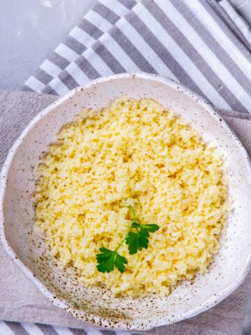 overhead view of couscous on a white plate