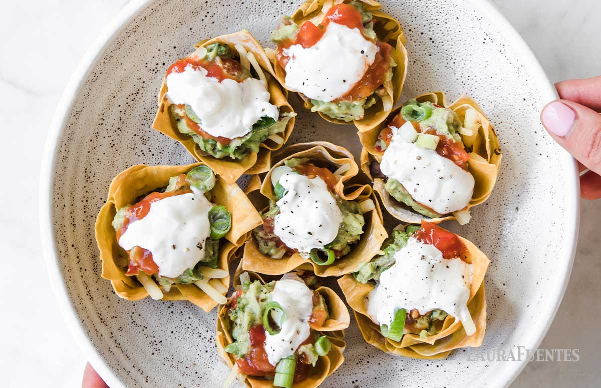 seven taco cupcakes on a plate
