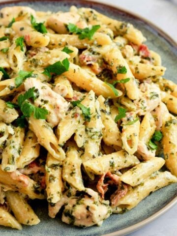 a plate with rotisserie chicken pasta with fresh herbs
