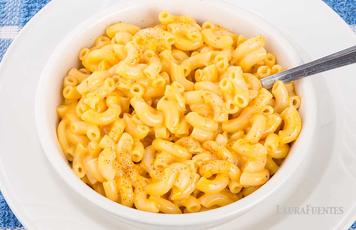 large bowl of macaroni and cheese with a spoon