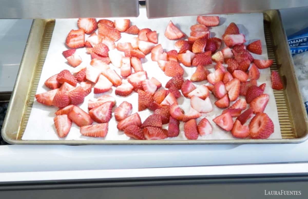 strawberries going into a freezer