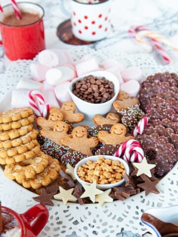 hot chocolate charcuterie board of toppings and cookies