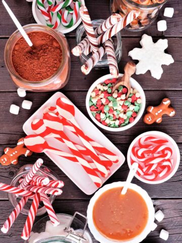 toppings and candy for hot chocolate laid out on a board
