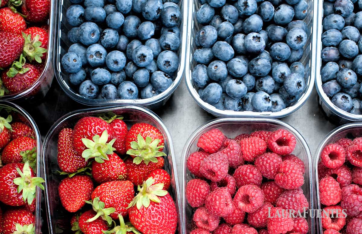 various berries in small boxes 