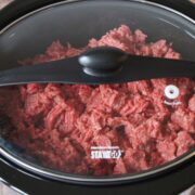 ground beef in a lidded slow cooker