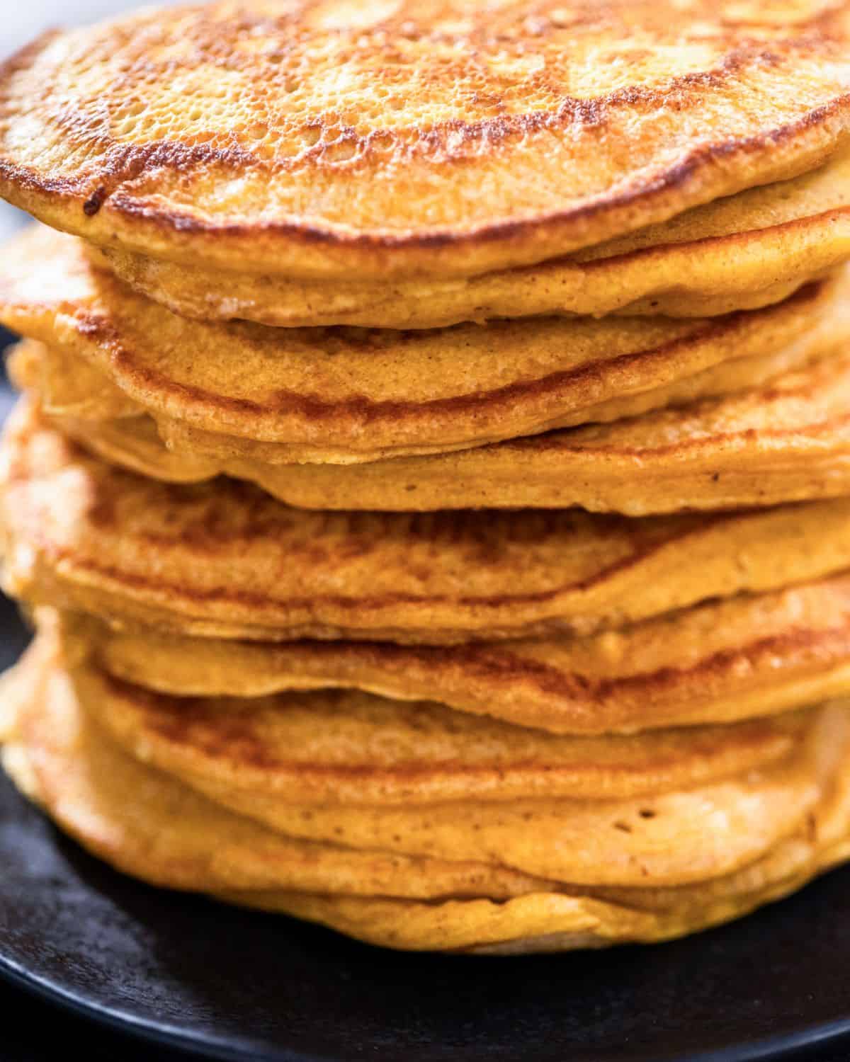 close up of a large stack of pumpkin pancakes