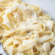 close up view of fettuccini in a homemade Alfredo sauce made with cottage cheese so it's high protein