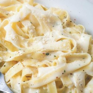 close up view of fettuccini in a homemade Alfredo sauce made with cottage cheese so it's high protein