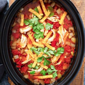 top view of tortilla soup in the slow cooker pot.