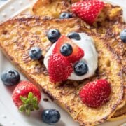 French toast made with sourdough bread and topped with fresh berries