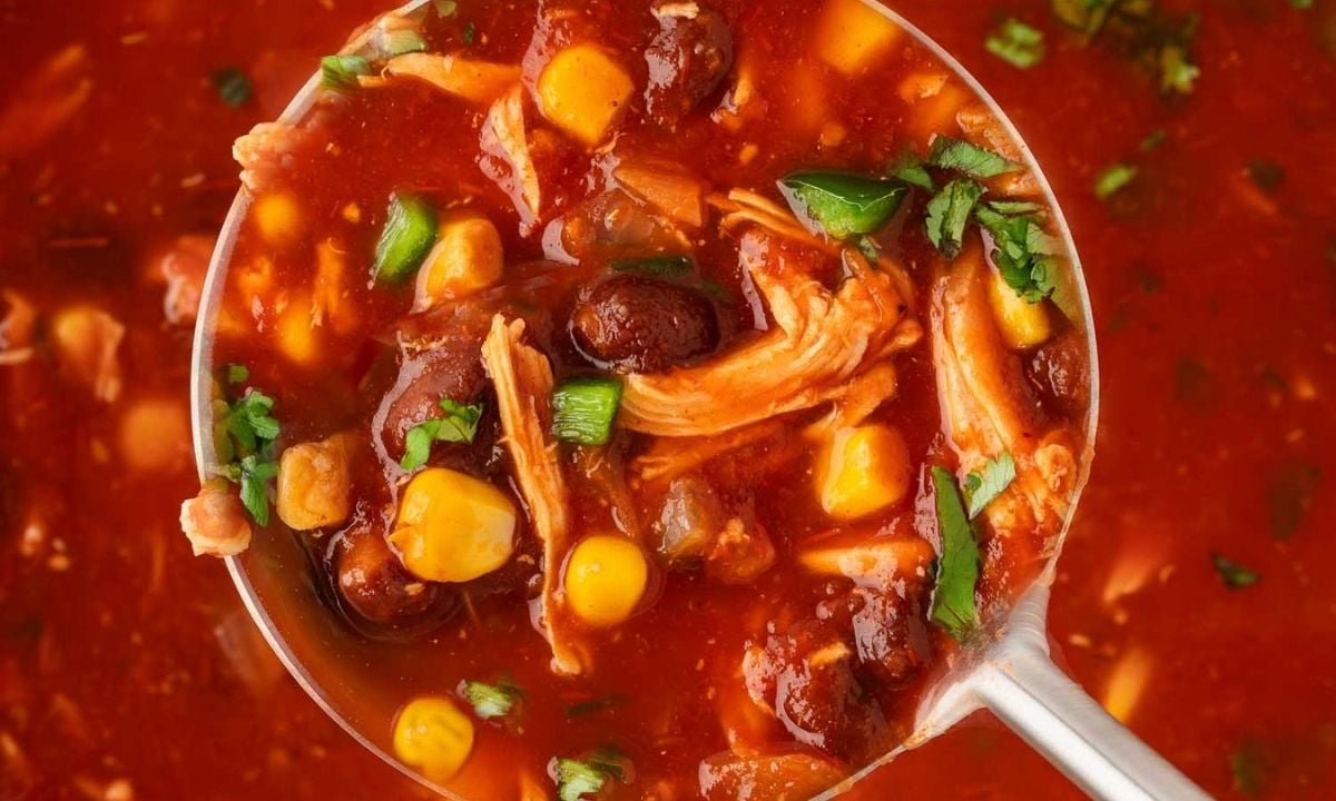 a soup spoon with rotisserie chicken taco soup