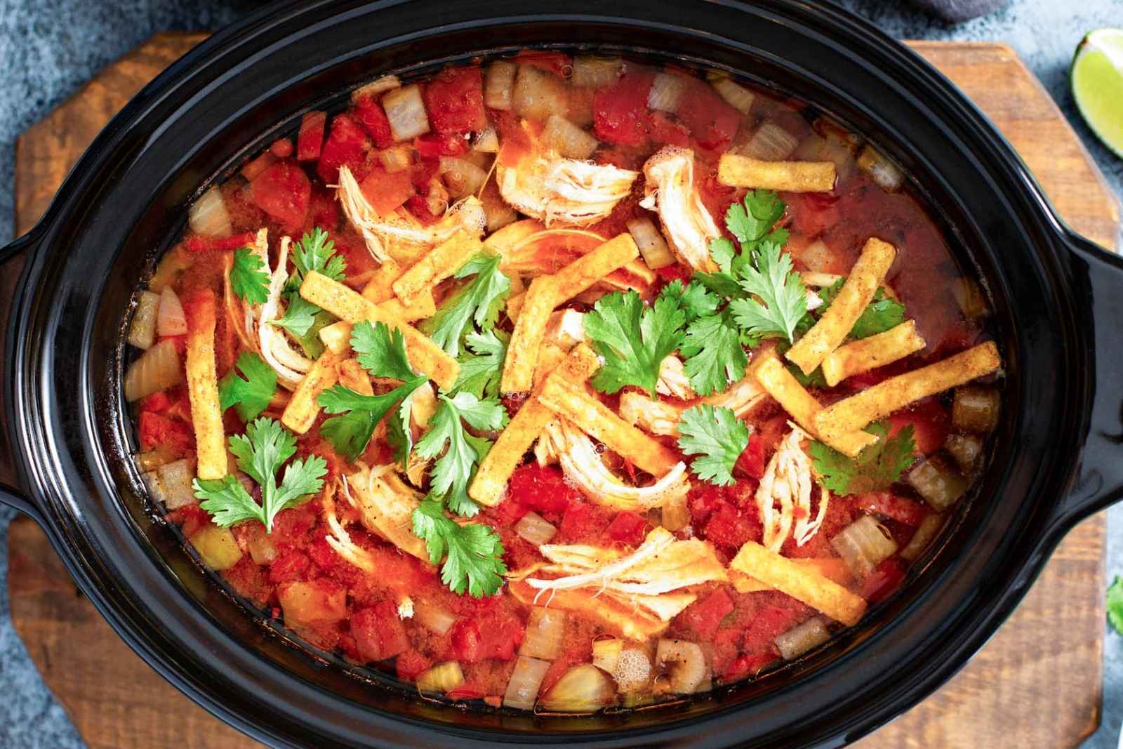 top view of tortilla soup in the slow cooker pot