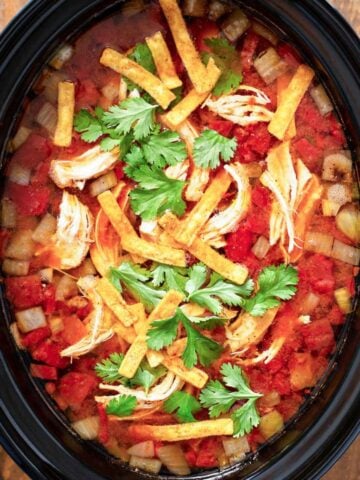 top view of tortilla soup in the slow cooker pot