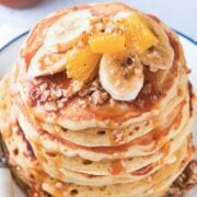 pancakes topped with nuts and fruit
