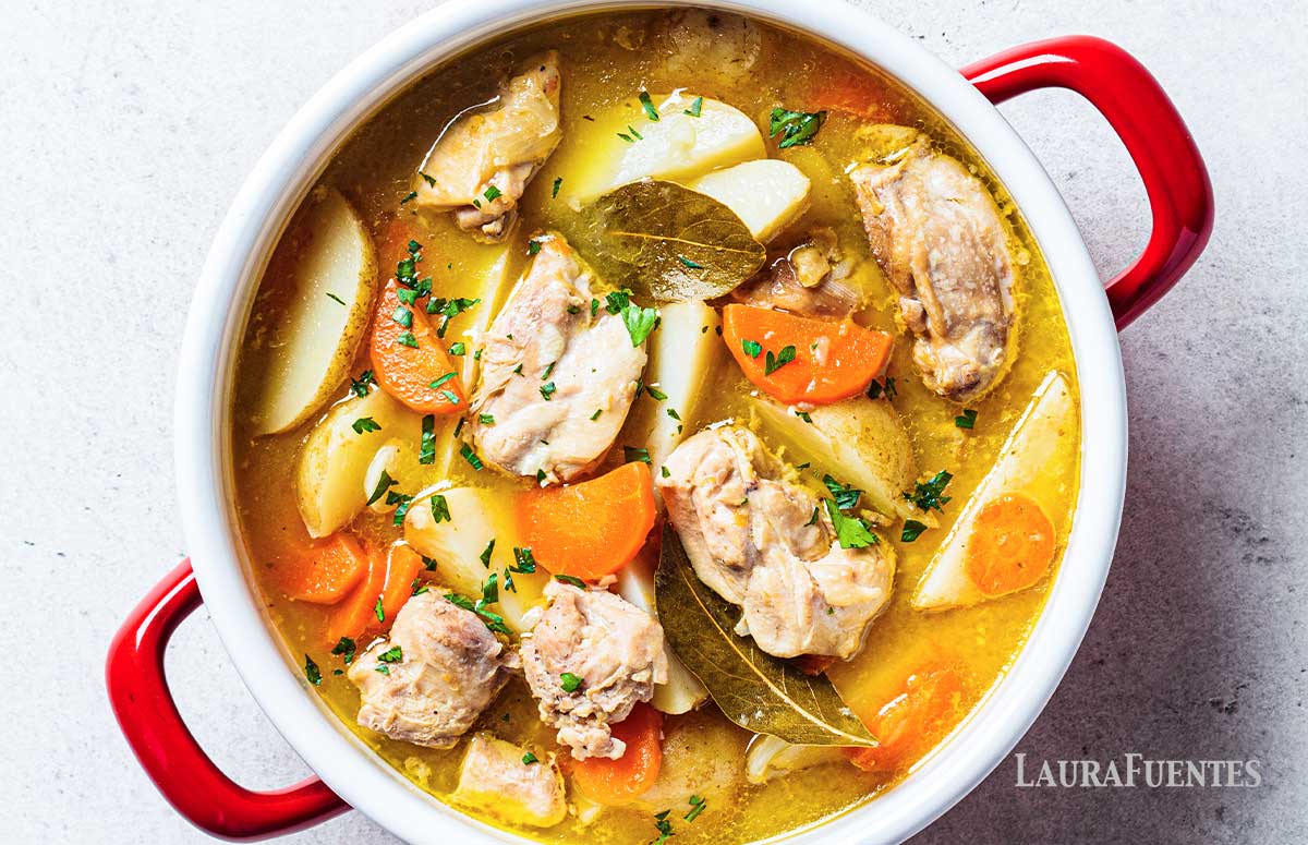 a pot with chicken stew and potatoes