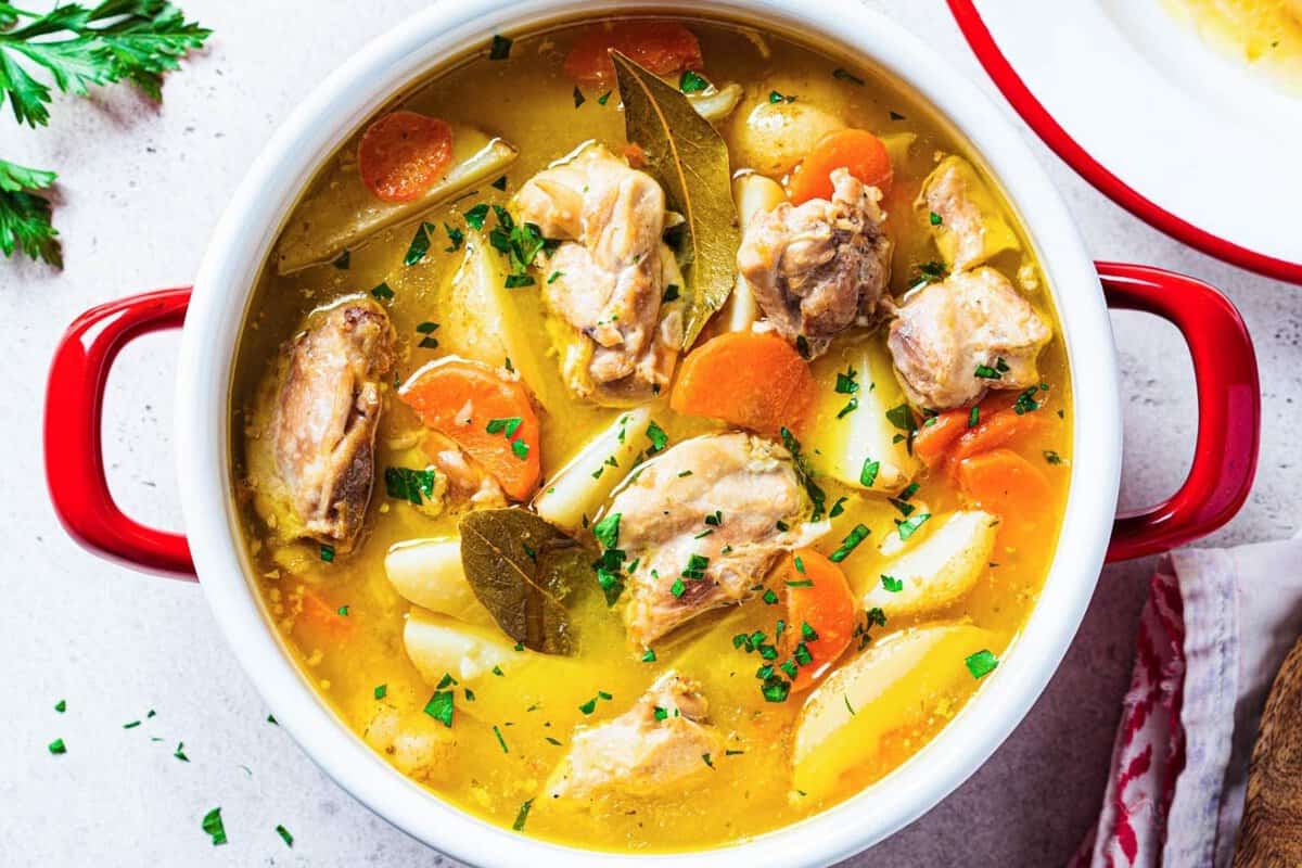 a pot with chicken stew and potatoes